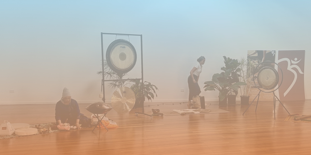 Image of gongs and yogis in preparation for yogic somatic healing